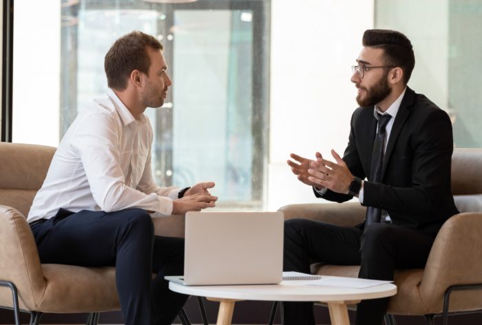 Two men advice being given